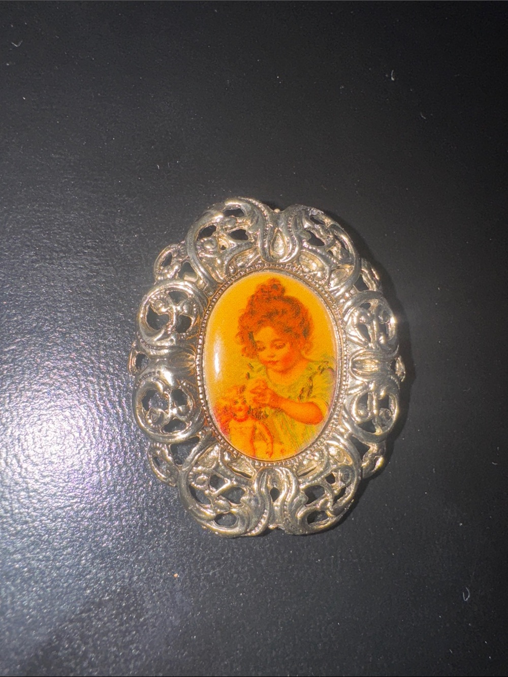 Vintage oval gold tone filigree brooch  portrait of a little girl